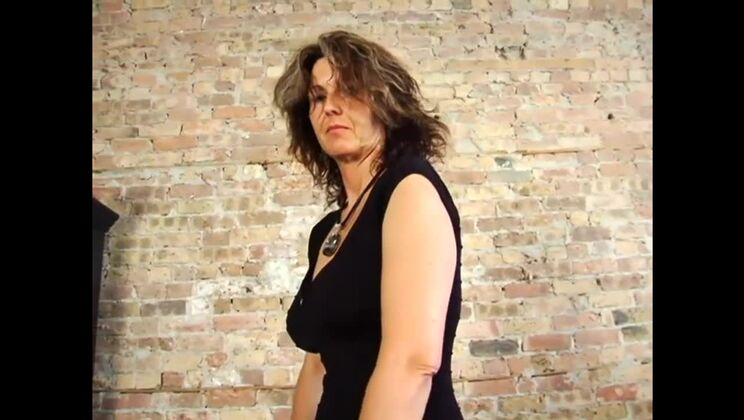 Nicole Bends Over Showing Big Tits